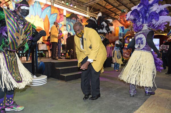 Carnival season kicks off on Jan. 6 in New Orleans. Members of the Zulu Social Aid and Pleasure Club celebrate the beginning of the season at a 2021 event with the city’s mayor, LaToya Cantrell.